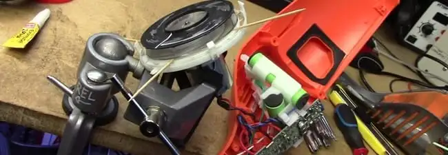 Vacuum cleaner repair parts and tools on a workbench in Rockford, IL